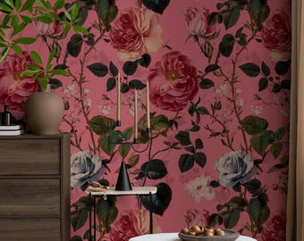 May include: Wallpaper featuring a repeating pattern of large pink and blue roses with dark green leaves on a solid pink background. The floral design covers the entire wall surface, showcasing detailed botanical illustrations of blooming flowers.