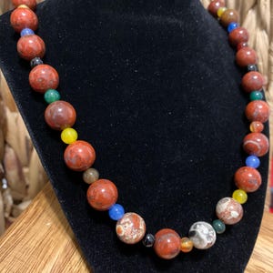 Sandstone. Multi-colored round Poppy Jasper bead necklace.
