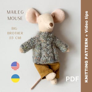 May include: Knitting pattern PDF for a Maileg Big Brother Mouse, a 13 cm plush toy mouse wearing a green and brown sweater and brown pants. The pattern includes video tips. The image also shows the American and Ukrainian flags.