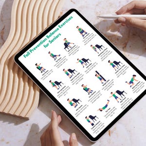 May include: A digital tablet displays "Fall Prevention Balance Exercises for Seniors." The screen shows illustrated exercises with stick figures. A white stylus hovers above the screen. The tablet is on a marble surface.