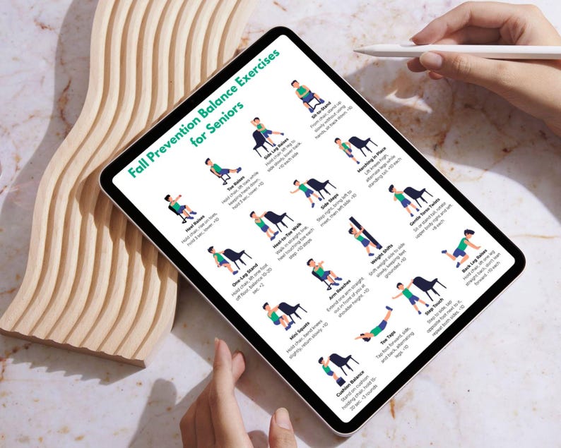 May include: A digital tablet displays "Fall Prevention Balance Exercises for Seniors." The screen shows illustrated exercises with stick figures. A white stylus hovers above the screen. The tablet is on a marble surface.