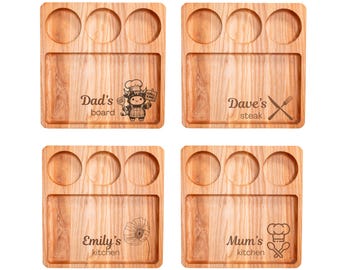 May include: Four wooden serving boards with a natural wood grain. Each board has three circular indentations and a rectangular section. Text and graphics include "Dad's board", "Dave's steak", "Emily's kitchen", and "Mum's kitchen".