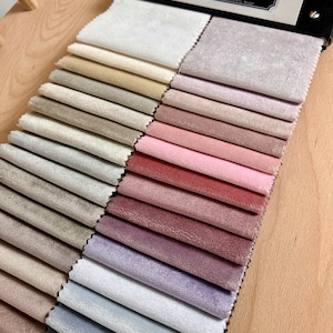 May include: A fabric swatch book with a variety of colors and textures. The book is labeled "Matt Allen, Specially Made."