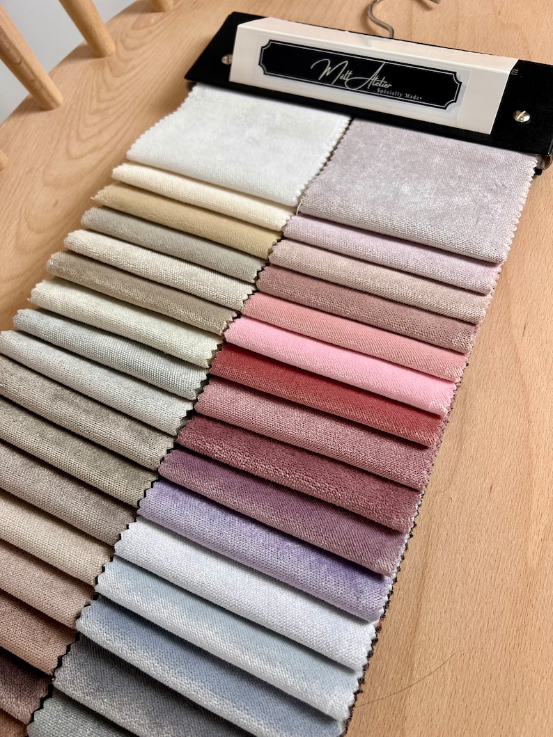May include: A fabric swatch book with a variety of colors and textures. The book is labeled "Matt Allen, Specially Made."