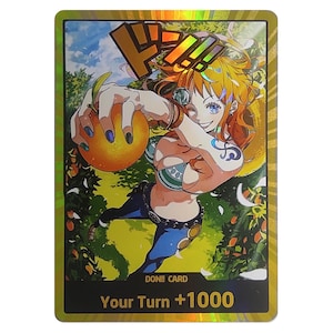 May include: A trading card featuring a character with orange hair and blue eyes, holding an orange fruit. The card has a gold border and text that reads "DON!! CARD" and "Your Turn +1000". The background shows an orange grove.