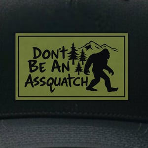 Funny Bigfoot Patch Hat – “Don’t Be an Assquatch” Leatherette Patch – Sasquatch Gift for Hikers, Campers, Cryptid Fans