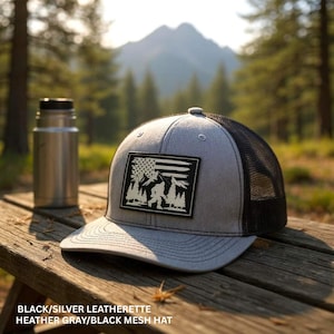 bigfoot American flag hat sasquatch gift for bigfoot believer fun patriotic hat flag behind bigfoot in the mountains hat