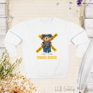 Unleash Your Fun Side with Our Adorable Teddy Bear Sweatshirt Featuring the Bold Statement 'Trouble Maker'
