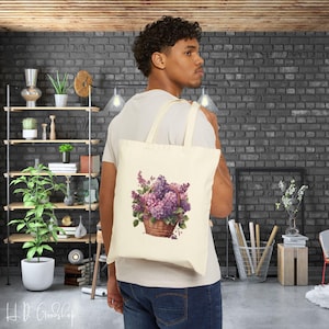 Tragen Sie die Schönheit der Blüten: Unsere Tragetasche 'Basket of Flower' - charmantes Design, das frische, lebendige Blumen zelebriert, perfekt für jeden Anlass