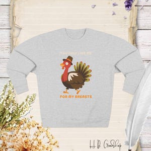 Add Humor to Your Thanksgiving Wardrobe with This Playful Sweatshirt - Perfect for Turkey Lovers and a Fun Twist on Holiday Tradition!
