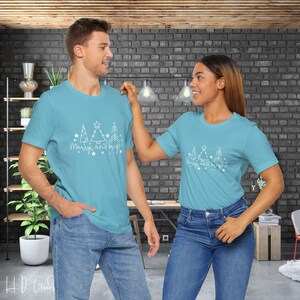 Spread Festive Cheer with Our 'Merry and Bright' Christmas T-Shirt - The Perfect Choice for Adding Extra Sparkle and Joy to Your Holiday!
