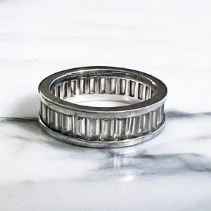 Sterling channel set baguette eternity ring