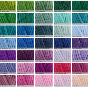 May include: A colour chart featuring forty swatches of plush, velvety yarn in various shades of green, blue, purple, and pink. Each swatch is labelled with a numerical code and a descriptive colour name, such as Apple Green, Teal, and Peach.