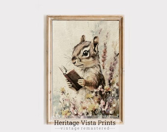 May include: A watercolor illustration of a brown and white chipmunk reading a book. The chipmunk is sitting in a field of pink and purple flowers. The image is framed in a light brown frame with the text "Heritage Vista Prints - vintage remastered -" at the bottom.