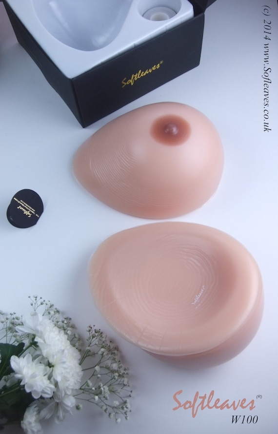 A set of Softleaves W100 Silicone Breast Forms Teardrop Shape includes a pair of  breast forms, Breast covers, adhesive tape, travel box