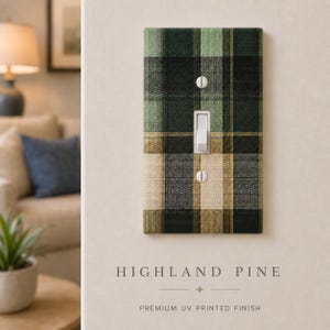 May include: A rectangular light switch cover plate featuring a green, black, and beige plaid pattern. The plate has a central vertical toggle switch and two silver screws, one above and one below the switch, with a premium UV printed finish.