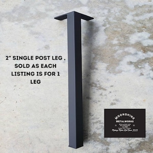 May include: A single black metal table leg, 2 inches wide, with a square post and a flat top. The leg is sold individually. The text "2" SINGLE POST LEG, SOLD AS EACH LISTING IS FOR 1 LEG" is visible in the image. The text "MOONSHINE METALWORKS" is also visible in the image.