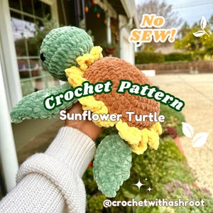 May include: A handmade crochet Sunflower Turtle in shades of green, brown, and yellow. The turtle has a sunflower design on its shell and is held in a person's hand. The text "Crochet Pattern Sunflower Turtle" is visible.
