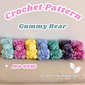 May include: A white ceramic mug with a black handle and the text "But First, Coffee" in a black, bold font. The mug is on a white surface.