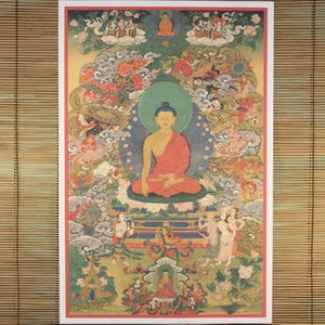 May include: A colorful Buddhist artwork featuring a seated Buddha figure in a red robe, surrounded by detailed depictions of celestial beings and ornate clouds. The artwork has a green halo and is set against a backdrop of various colors.