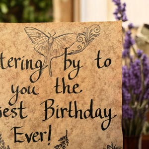 May include: A vintage-style card with a handwritten message that reads "Wishing you the happiest Birthday Ever!" The card is decorated with a butterfly, a bee, and floral designs. The text continues, "Filled with laughter, as light feather. May fireflies dance the stars shine bright, bringing you magic from morning..."