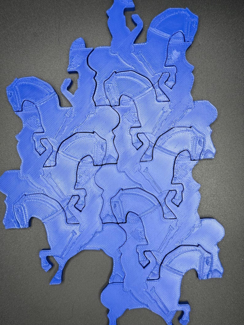May include: A blue jigsaw puzzle depicting a horse and rider in a repeating pattern. The pieces fit together to create a larger form. The design is a solid blue with a textured surface.