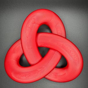 May include: A red, three-dimensional knot sculpture. The knot is made of a smooth, shiny material and is shaped like a cloverleaf.