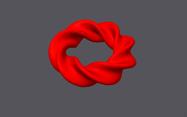 May include: A red, three-dimensional, abstract shape resembling a twisted ring or a knot. The shape is smooth and appears to be made of a soft, pliable material.