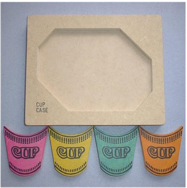 May include: A beige cardboard cup case with a cutout for a cup, and the text "CUP CASE". Below are four colorful cup-shaped cutouts in pink, yellow, teal, and orange, each with the word "CUP".
