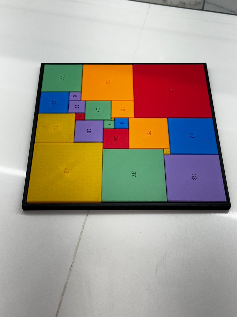 May include: A colorful square puzzle with numbers on each piece. The puzzle is made up of 16 different colored squares, each with a different number on it. The numbers range from 4 to 50.