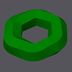 May include: A green, three-dimensional, hexagonal shape with a hole in the center.