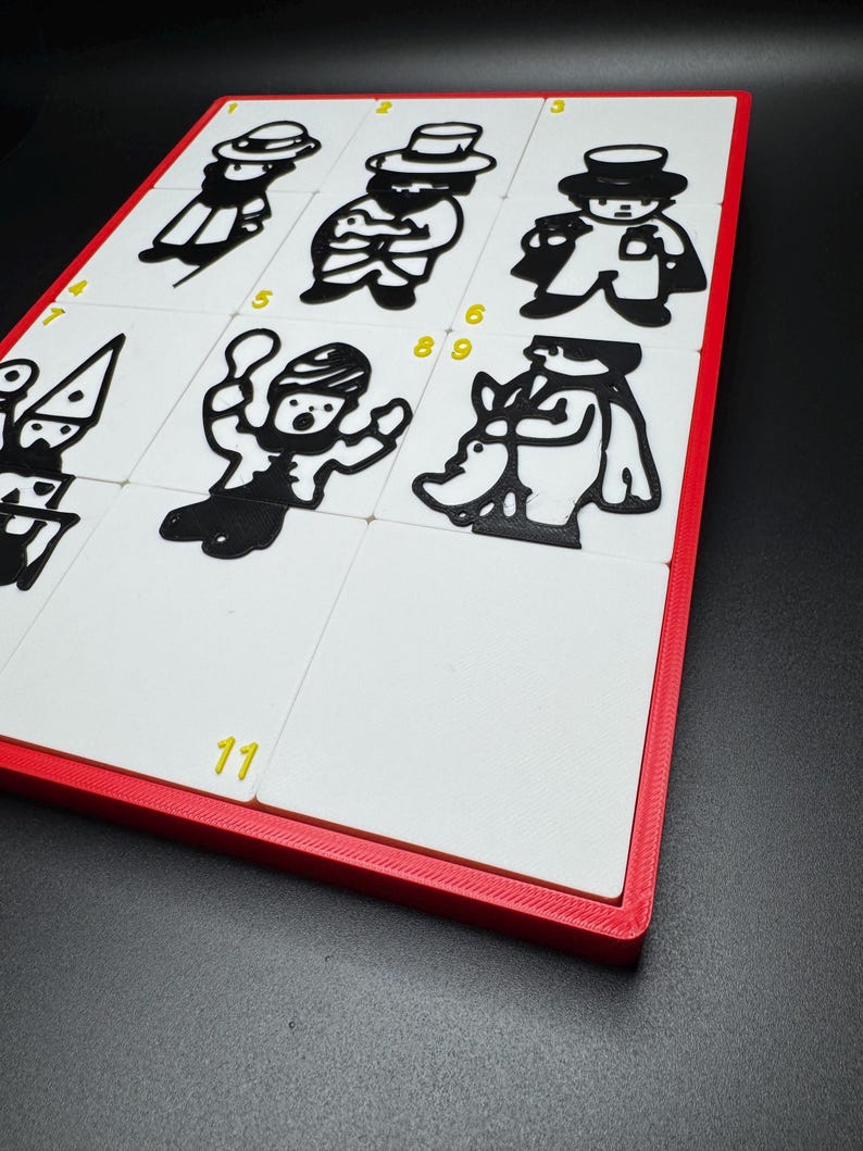 May include: A white board with a red frame and eleven numbered squares. Each square contains a black and white illustration of a person. The numbers 1, 2, 3, 4, 5, 6, 9, and 11 are visible.