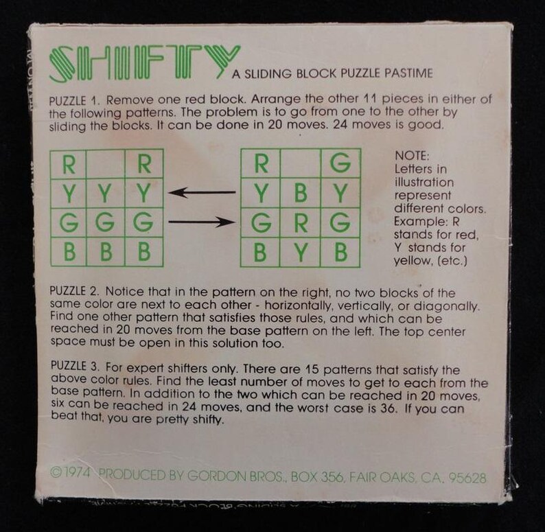 May include: A vintage game called "Shifty" with instructions for a sliding block puzzle. The game involves arranging colored blocks in a grid pattern. The instructions explain the rules and challenges of the game.