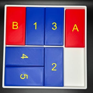 May include: A white tray with blue and red tiles. The tiles have yellow letters and numbers on them. The letters are "A" and "B". The numbers are "1", "2", "3", "4", and "5".