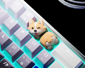 May include: A white and purple mechanical keyboard with a custom corgi-shaped keycap. The keycap is light brown and white, with a winking face. The keyboard has a blue backlight.