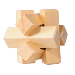 May include: A wooden puzzle with a complex design. The puzzle is made of multiple pieces that fit together to form a cube. The puzzle is made of light brown wood.