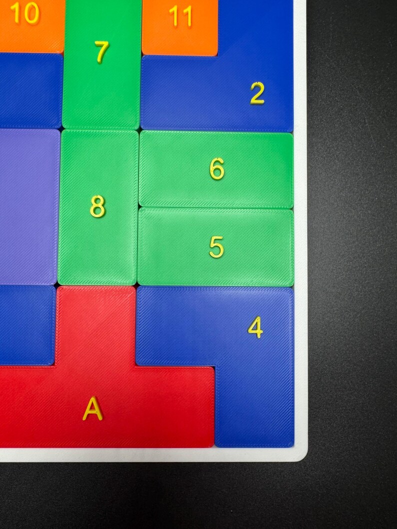May include: A colorful puzzle game with numbered tiles. The tiles are arranged in a grid pattern and are made of different colors, including red, green, blue, and orange. The numbers on the tiles are 1, 2, 3, 4, 5, 6, 7, 8, 10, and 11.