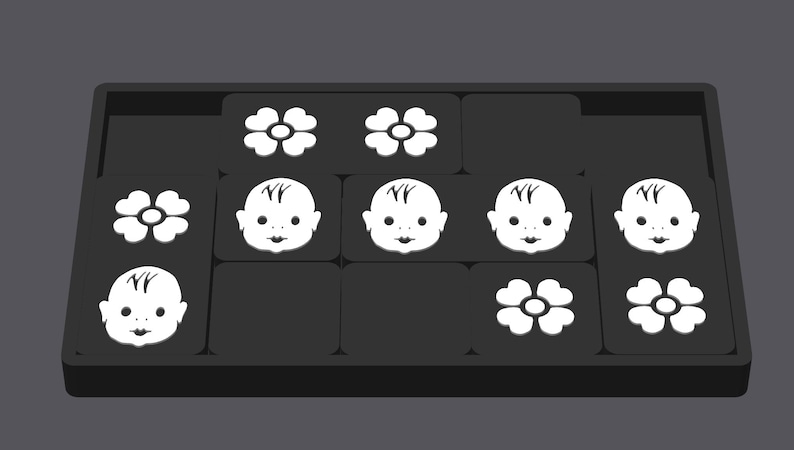 May include: A black tray with nine white tiles. Each tile has a different image: a flower, a baby face, or a flower with a circle in the center.