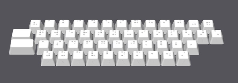 May include: A white keyboard with braille lettering on each key. The keyboard has two rows of keys and a row of two larger keys at the top.