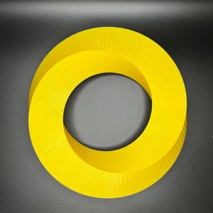 May include: A bright yellow, 3D printed, Mobius strip shaped object. The object is a continuous loop with a hole in the center.