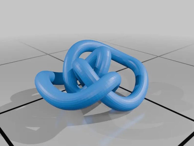 May include: A blue plastic knot sculpture. The knot is made of several loops that are intertwined with each other.
