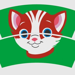 May include: A cartoon cat face with red and white fur, blue eyes, and a pink nose is centered on a green background. The cat has a smiling expression and a red collar. The design is on a curved shape.
