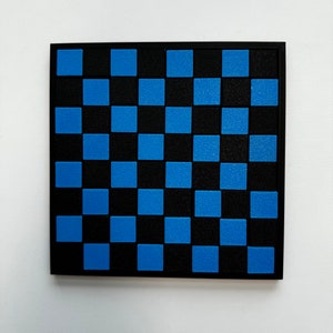 May include: A black and blue checkerboard game board.