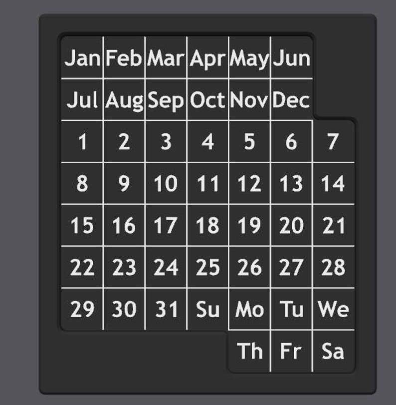 K&ouml;nnte beinhalten: Ein schwarz-wei&szlig;er Kalender mit den Monaten des Jahres oben und den Wochentagen unten. Die Zahlen von 1 bis 31 sind im Kalenderraster aufgelistet.