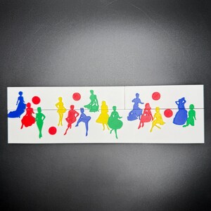 May include: A white surface with colorful cutouts of people in various poses. The cutouts are in blue, green, red, and yellow. There are also red circles scattered around the cutouts.