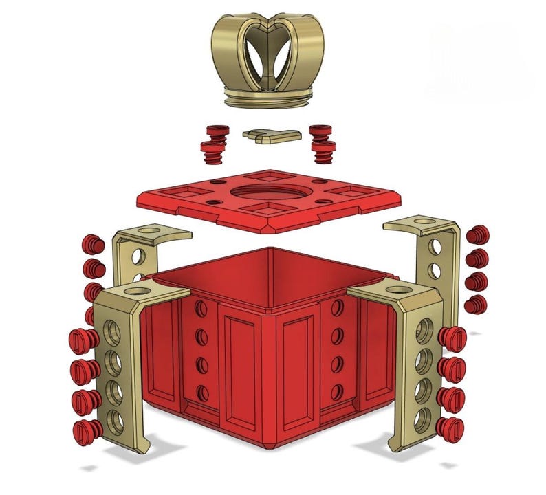 May include: A disassembled 3D printed chess king piece. The king is made of red and gold plastic. The king is made up of a base, four side pieces, a top piece, and a crown. The crown is separate from the top piece.
