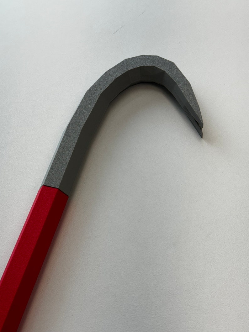 May include: A red and gray pry bar with a curved handle.