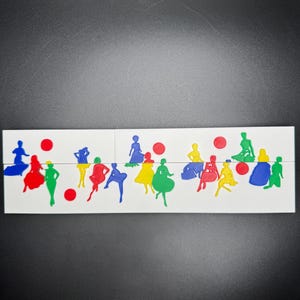 May include: A set of colorful, cutout figures of people in various poses. The figures are arranged in a row on a white surface. There are red circles scattered throughout the arrangement.