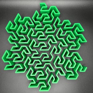 May include: A green 3D printed snowflake shaped maze with a complex design.