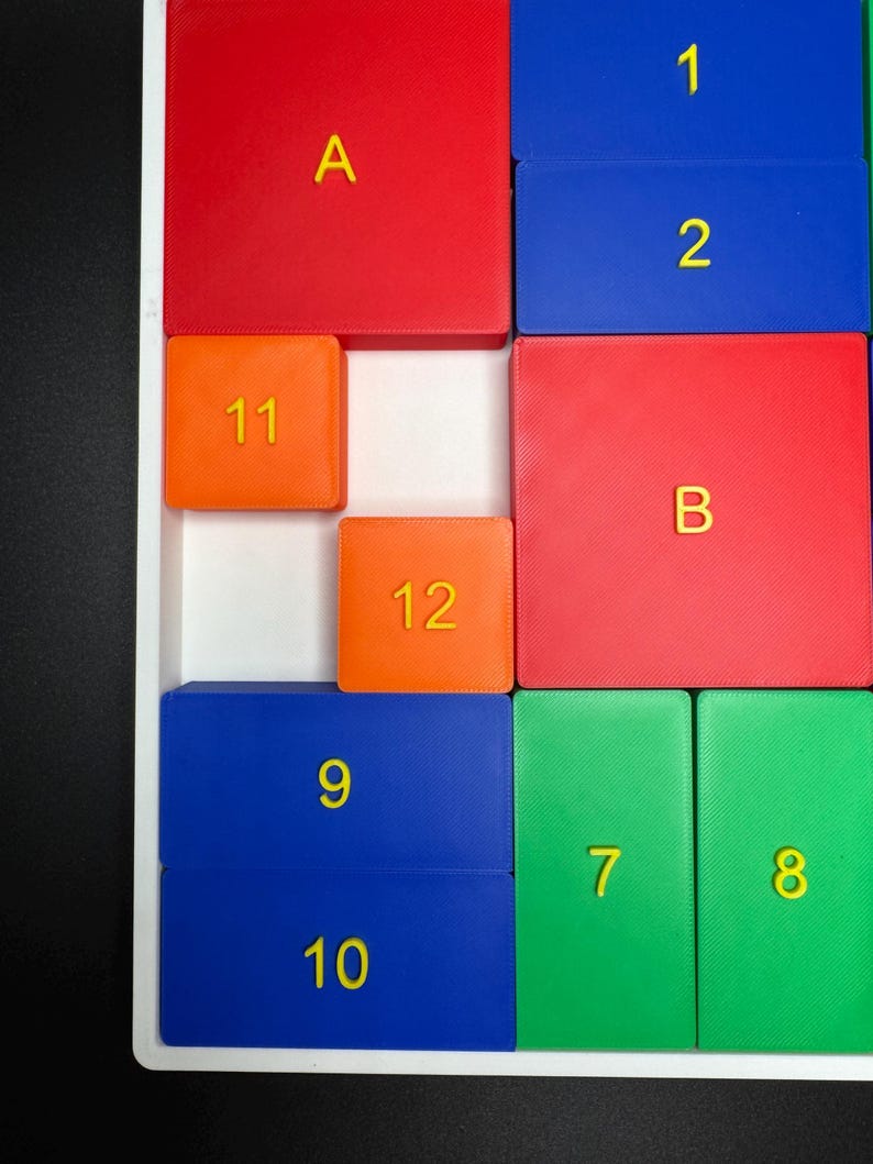 May include: A colorful puzzle with numbered and lettered tiles. The tiles are arranged in a grid pattern. The numbers 1, 2, 7, 8, 9, 10, 11, and 12 are visible. The letters A and B are also visible.